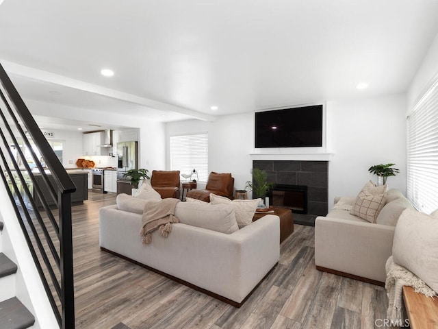 1914 Radford St, Oceanside, CA 92056 - living area featuring stairs, wood finished floors, a tiled fireplace, and recessed lighting