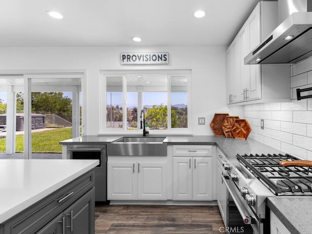 1914 Radford St, Oceanside, CA 92056 - kitchen featuring wall chimney range hood, a sink, high end range, healthy amount of natural light, and recessed lighting