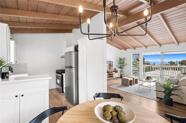 135 High Dr, Laguna Beach, CA 92651 - dining room with wooden ceiling, light wood finished floors, a chandelier, and baseboards
