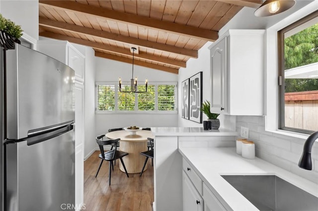 135 High Dr, Laguna Beach, CA 92651 - kitchen with freestanding refrigerator, wooden ceiling, light countertops, a sink, and backsplash