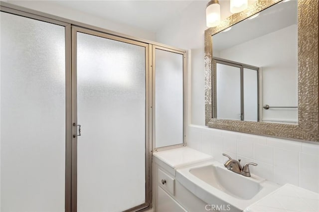135 High Dr, Laguna Beach, CA 92651 - bathroom with decorative backsplash, vanity, and a shower stall