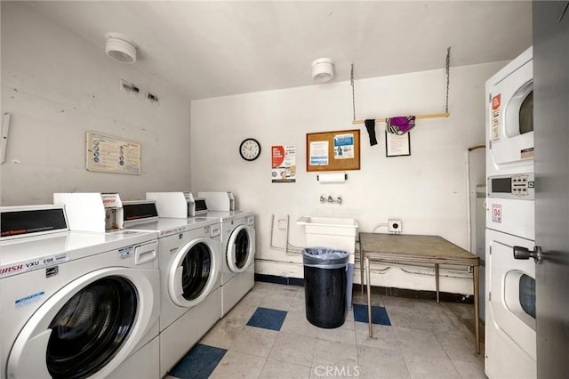 1187 E 3rd St Unit 104, Long Beach, CA 90802 - community laundry featuring washing machine and dryer and baseboards