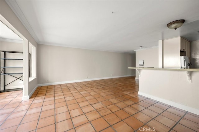 1187 E 3rd St Unit 104, Long Beach, CA 90802 - unfurnished living room featuring crown molding, light tile patterned floors, and baseboards
