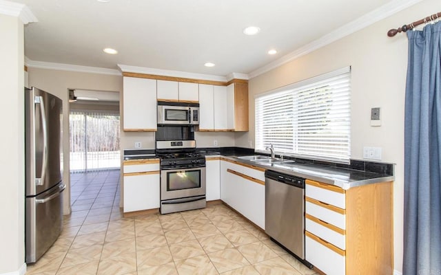 5402 Old Ranch Rd, Oceanside, CA 92057 - kitchen featuring appliances with stainless steel finishes, a sink, white cabinetry, recessed lighting, and crown molding
