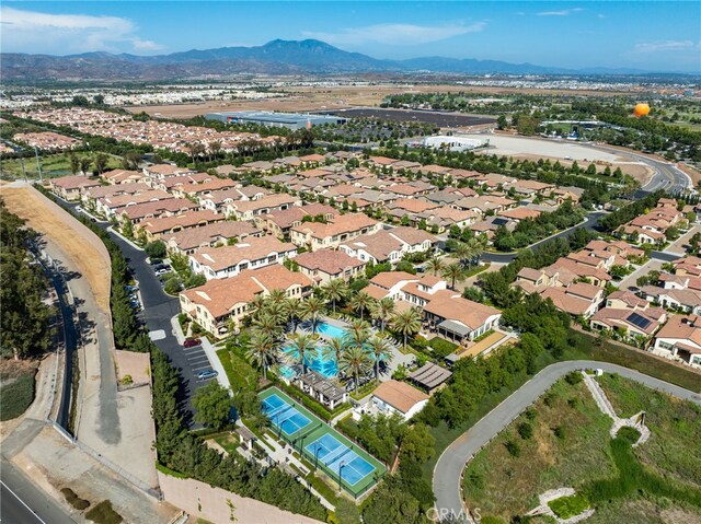 223 Carlow, Irvine, CA 92618 - aerial view of property and surrounding area with nearby suburban area and a mountainous background