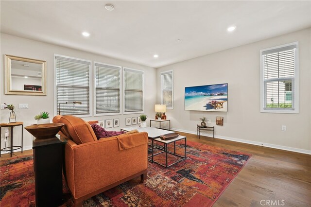 223 Carlow, Irvine, CA 92618 - living room featuring wood finished floors, baseboards, and recessed lighting