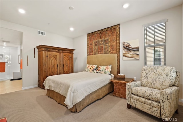 223 Carlow, Irvine, CA 92618 - bedroom with light carpet, recessed lighting, connected bathroom, and baseboards