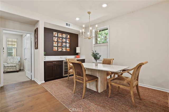 223 Carlow, Irvine, CA 92618 - dining room with plenty of natural light, a chandelier, wood finished floors, recessed lighting, and baseboards
