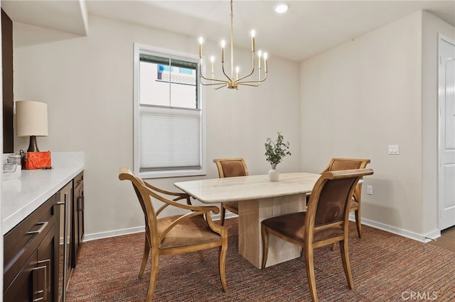 223 Carlow, Irvine, CA 92618 - dining space with baseboards, a chandelier, and dark carpet
