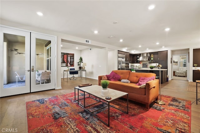 223 Carlow, Irvine, CA 92618 - living area featuring french doors, light wood finished floors, and recessed lighting