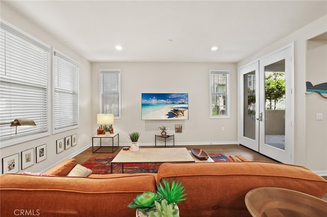 223 Carlow, Irvine, CA 92618 - living room featuring wood finished floors, baseboards, recessed lighting, and french doors