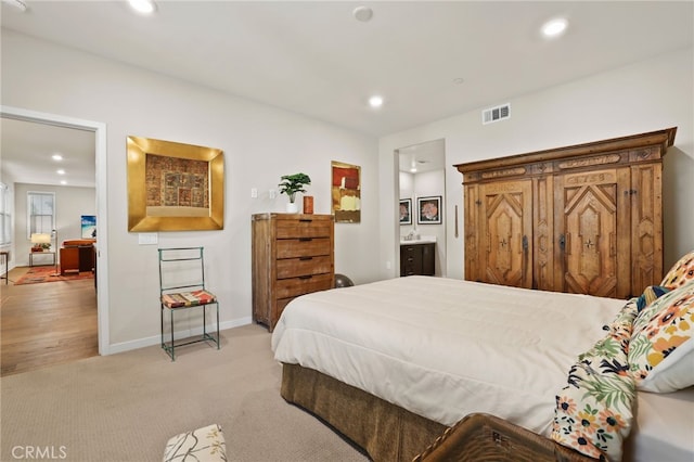 223 Carlow, Irvine, CA 92618 - bedroom featuring recessed lighting, light carpet, baseboards, and ensuite bathroom