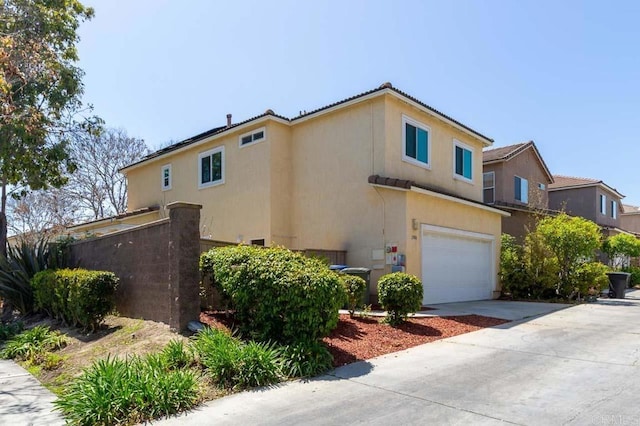 1306 Mill Valley Rd, Chula Vista, CA 91913 - view of front of house with an attached garage, stucco siding, and concrete driveway