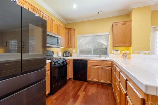 1306 Mill Valley Rd, Chula Vista, CA 91913 - kitchen with black appliances, tile countertops, dark wood-style floors, crown molding, and a peninsula