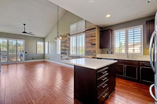 3313 Dehesa Rd Unit 85, El Cajon, CA 92019 - kitchen with open floor plan, light countertops, ceiling fan, dark wood-type flooring, and a kitchen island