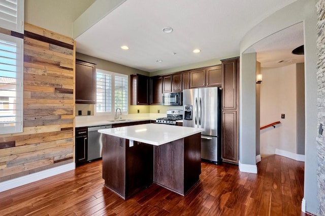 3313 Dehesa Rd Unit 85, El Cajon, CA 92019 - kitchen featuring stainless steel appliances, a kitchen island, light countertops, dark wood finished floors, and recessed lighting