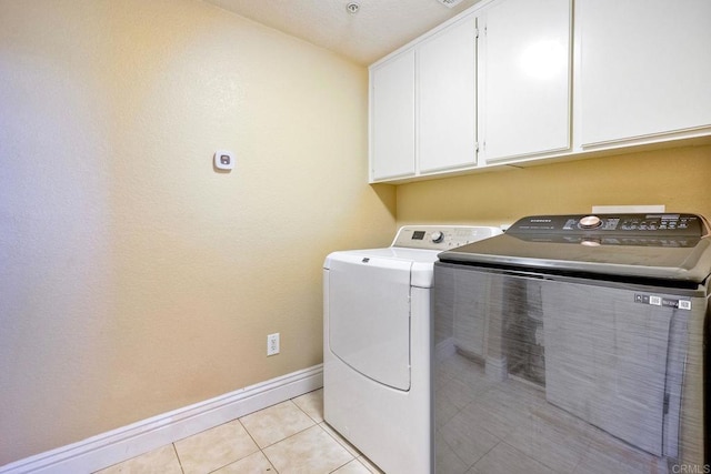3313 Dehesa Rd Unit 85, El Cajon, CA 92019 - laundry room with cabinet space, separate washer and dryer, and light tile patterned floors