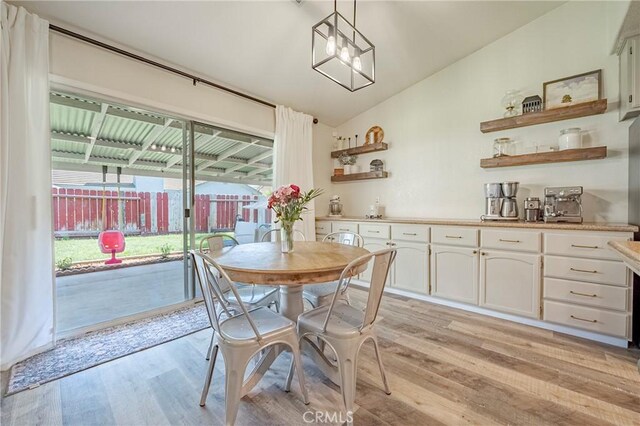 1266 Panorama Point Ct, Merced, CA 95340 - dining room with lofted ceiling and light wood-style floors