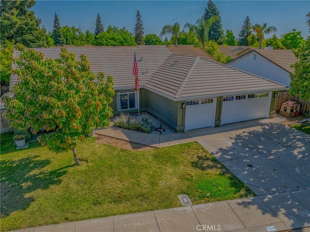 1266 Panorama Point Ct, Merced, CA 95340 - ranch-style home featuring a garage, a tile roof, concrete driveway, and stucco siding