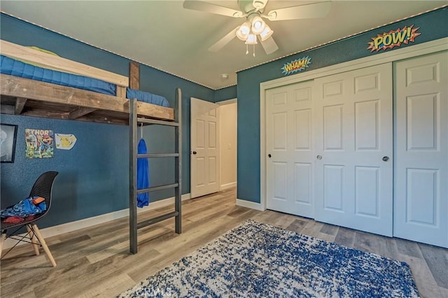 1266 Panorama Point Ct, Merced, CA 95340 - bedroom with wood finished floors, a closet, baseboards, and a ceiling fan