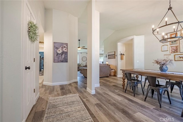 1266 Panorama Point Ct, Merced, CA 95340 - dining area featuring light wood-type flooring, a chandelier, a ceiling fan, and baseboards