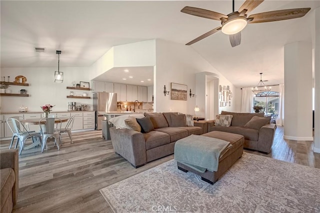 1266 Panorama Point Ct, Merced, CA 95340 - living area featuring light wood finished floors, ceiling fan, and lofted ceiling