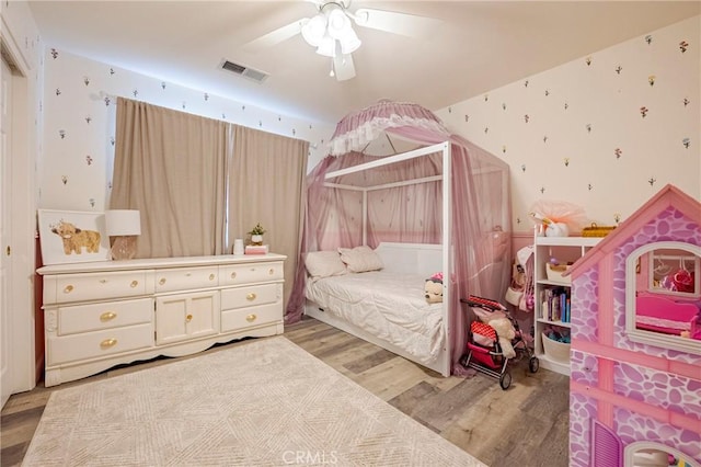 1266 Panorama Point Ct, Merced, CA 95340 - bedroom with wallpapered walls, light wood-type flooring, and ceiling fan