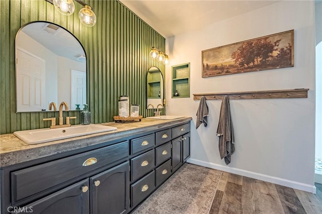 1266 Panorama Point Ct, Merced, CA 95340 - full bath with double vanity, wood finished floors, and baseboards