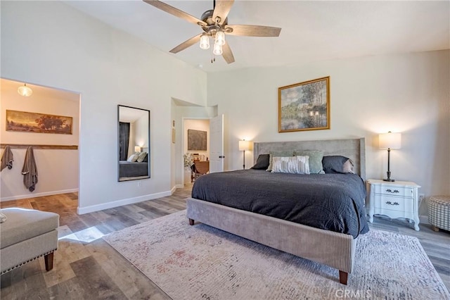 1266 Panorama Point Ct, Merced, CA 95340 - bedroom with wood finished floors, baseboards, lofted ceiling, and ceiling fan