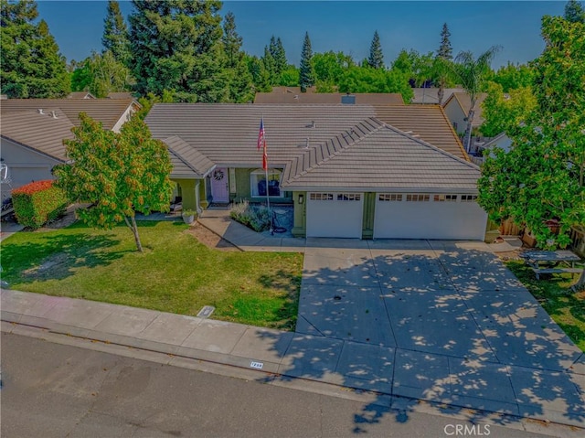 1266 Panorama Point Ct, Merced, CA 95340 - ranch-style home featuring a tile roof, driveway, a front lawn, and a garage
