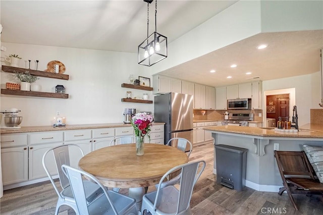 1266 Panorama Point Ct, Merced, CA 95340 - dining room featuring light wood finished floors and recessed lighting