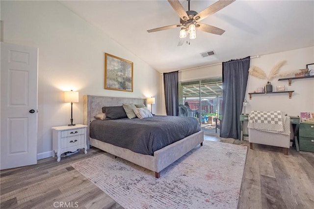 1266 Panorama Point Ct, Merced, CA 95340 - bedroom with access to outside, lofted ceiling, wood finished floors, and a ceiling fan