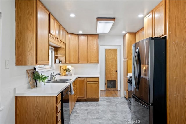 1000 W 11th Ave, Chico, CA 95926 - kitchen featuring freestanding refrigerator, gas range oven, a sink, light countertops, and dishwasher