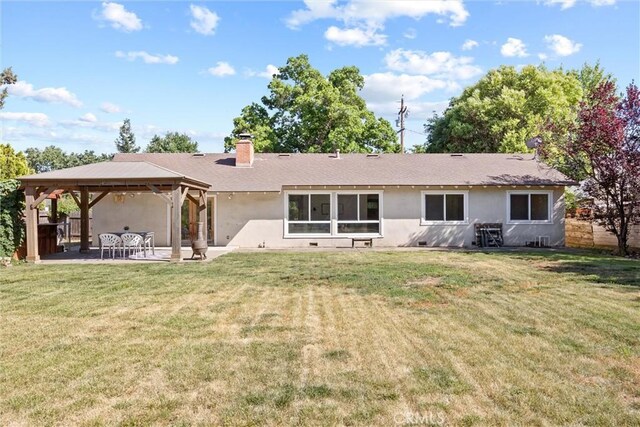 1000 W 11th Ave, Chico, CA 95926 - rear view of property featuring a gazebo, a patio area, a yard, and stucco siding