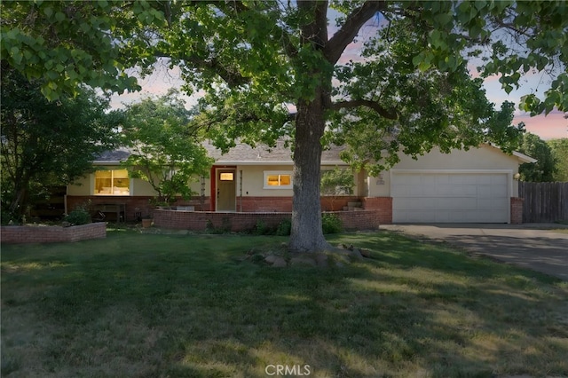 1000 W 11th Ave, Chico, CA 95926 - view of front of property featuring brick siding, an attached garage, and driveway