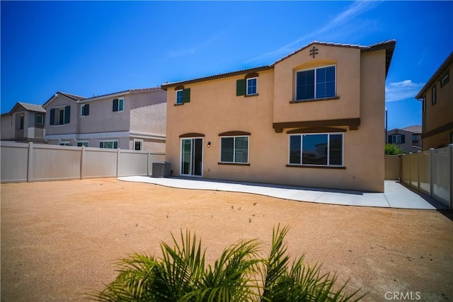 32939 Fleets Rd, Menifee, CA 92584 - rear view of property featuring a patio area, stucco siding, and a fenced backyard