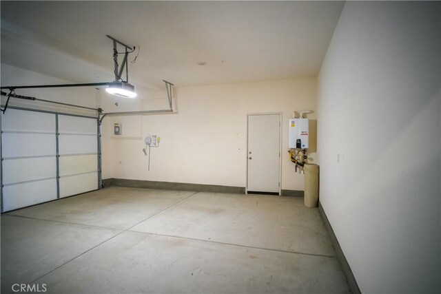 32939 Fleets Rd, Menifee, CA 92584 - garage with a garage door opener and tankless water heater