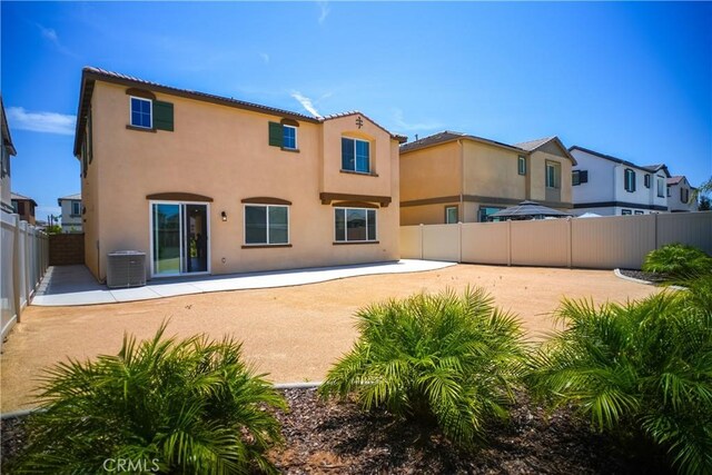 32939 Fleets Rd, Menifee, CA 92584 - back of house featuring stucco siding, a patio, and a fenced backyard