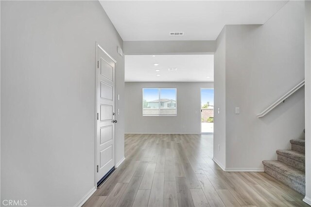 32939 Fleets Rd, Menifee, CA 92584 - hallway featuring stairs and light wood-type flooring