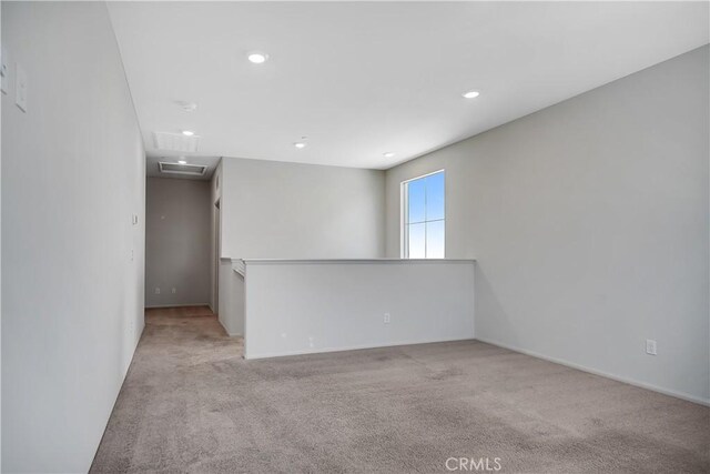 32939 Fleets Rd, Menifee, CA 92584 - spare room featuring light carpet, recessed lighting, and attic access