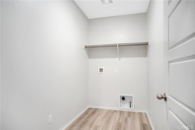 32939 Fleets Rd, Menifee, CA 92584 - washroom featuring washer hookup, light wood-type flooring, and electric dryer hookup