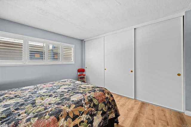 3612 Vista Bella Unit 5, Oceanside, CA 92057 - bedroom with light wood-style flooring and a closet