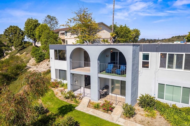 3612 Vista Bella Unit 5, Oceanside, CA 92057 - rear view of house featuring a balcony and stucco siding