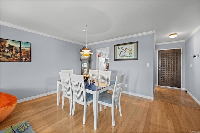 3612 Vista Bella Unit 5, Oceanside, CA 92057 - dining space with crown molding, light wood-style flooring, and baseboards