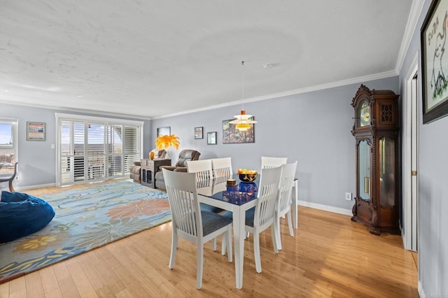 3612 Vista Bella Unit 5, Oceanside, CA 92057 - dining room with light wood-style flooring and ornamental molding