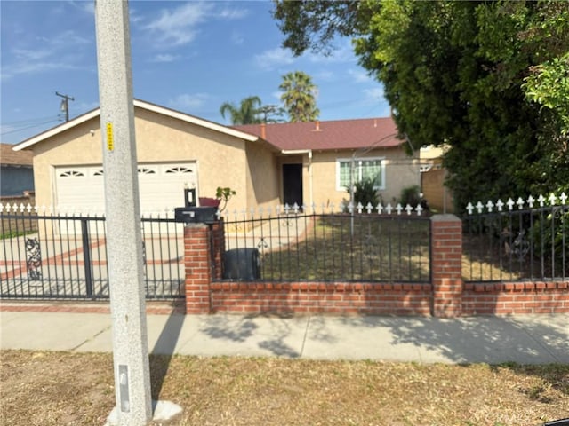 3401 Millbury Ave, Baldwin Park, CA 91706 - single story home featuring stucco siding, a fenced front yard, a garage, and driveway