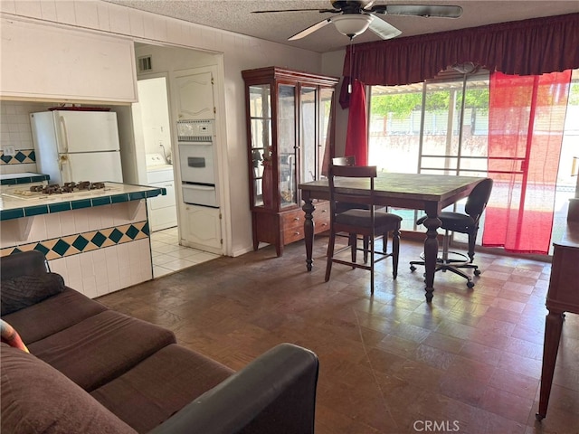 3401 Millbury Ave, Baldwin Park, CA 91706 - dining space with washer / dryer, ceiling fan, and a textured ceiling
