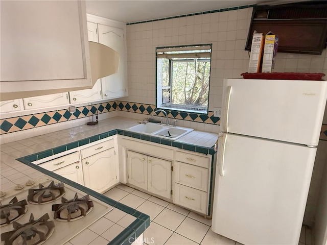 3401 Millbury Ave, Baldwin Park, CA 91706 - kitchen with white appliances, a sink, decorative backsplash, and tile countertops