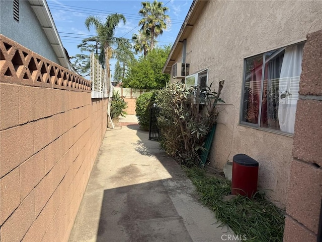 3401 Millbury Ave, Baldwin Park, CA 91706 - view of side of property featuring stucco siding and a patio area