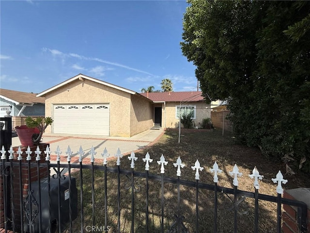 3401 Millbury Ave, Baldwin Park, CA 91706 - single story home featuring stucco siding, an attached garage, and concrete driveway
